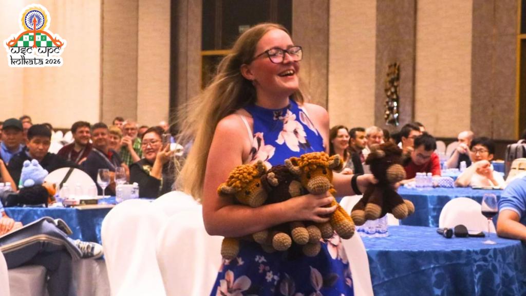 Participant carrying plushies at WPC 2026