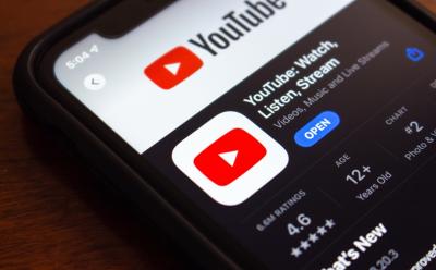 close up shot of an iPhone previewing the App Store landing screen of the YouTube app