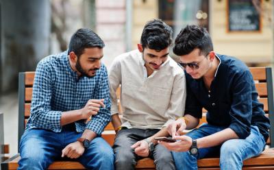 Indian youth using smartphones shutterstock website