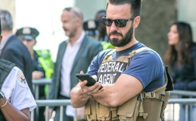 Police with smartphone feat.