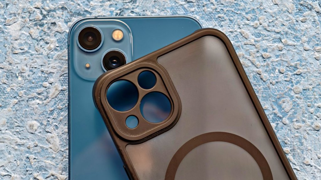 iPhone 13 with a black case on its back