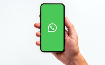The WhatsApp logo depicted on an Android device placed on a white background