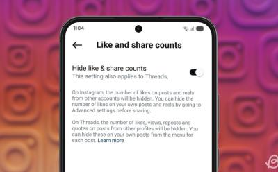 phone previewing the Hide like & share counts option inside the Instagram app with a gradient background filled with scattered Instagram logos