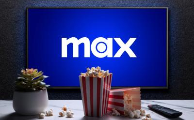 Max app welcome screen on a TV with tubs of popcorn in front