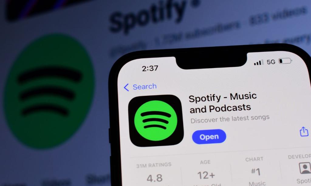 close-up shot of a phone showing the Spotify Premium app icon on Apple App Store