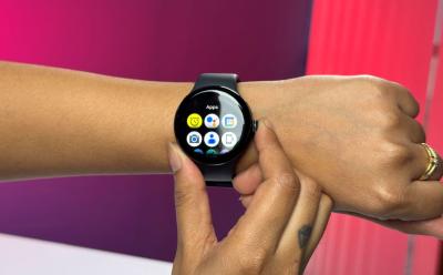 wrist wearing Pixel Watch 3 released in 2024 with apps shown in grid