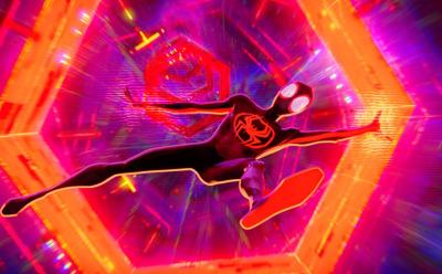A still of Miles Morales falling into a multiversal portal in Spider-Man Across The Spider-Verse