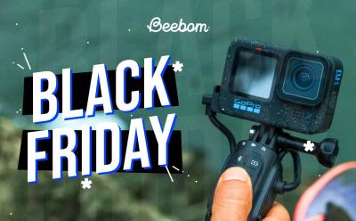 GoPro Hero 9 fixed to a tripod in front of a teal-ish background with Black Friday text on the left