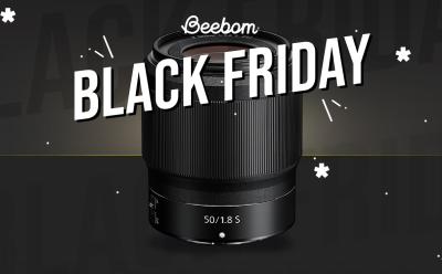 Image of Nikon NIKKOR Z 50mm f/1.8 S lens placed on a black desk with a grey background and black friday text at the top