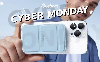 man holding an iPhone attached to an Anker 622 5000mAh MagGo charger with Cyber Monday text at the top