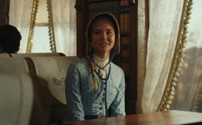 Elsa Dutton inside a train in 1883 series.