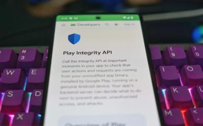 Image of Google Play Integrity web page with keyboard at the background