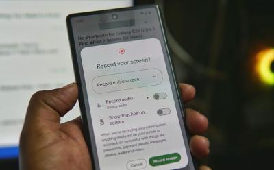 Google Pixel in hand with screen recorder options and shallow background
