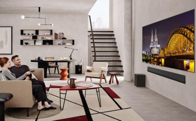 LG TV in a living room with a couple watching