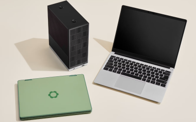 shot of the Framework Laptop 12, Laptop 13 and Modular Desktop placed on a beige-colored surface