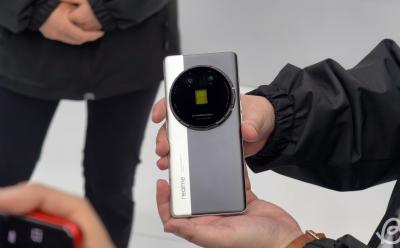 shot of someone holding Realme's Interchangeable Lens Concept phone