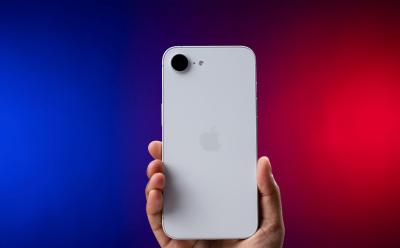 iPhone 16e held in hand showing of the design from the back 2