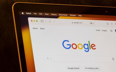 shot of the Google search interface on a web browser showing I'm Feeling Lucky option on a Macbook