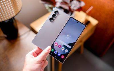 shot of a hand holding the Samsung Galaxy Z Fold 6 phone with its thin rear panel and front display