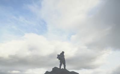 Sam on top of a mountain in Death Stranding 2