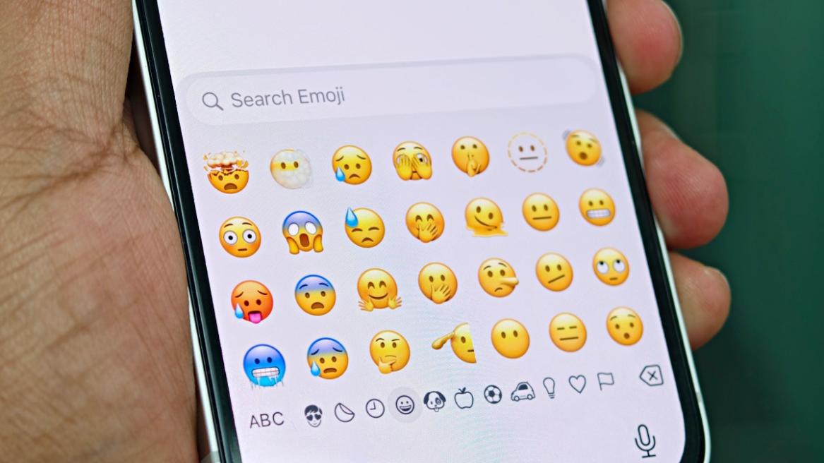 An emoji panel on an iPhone keyboard