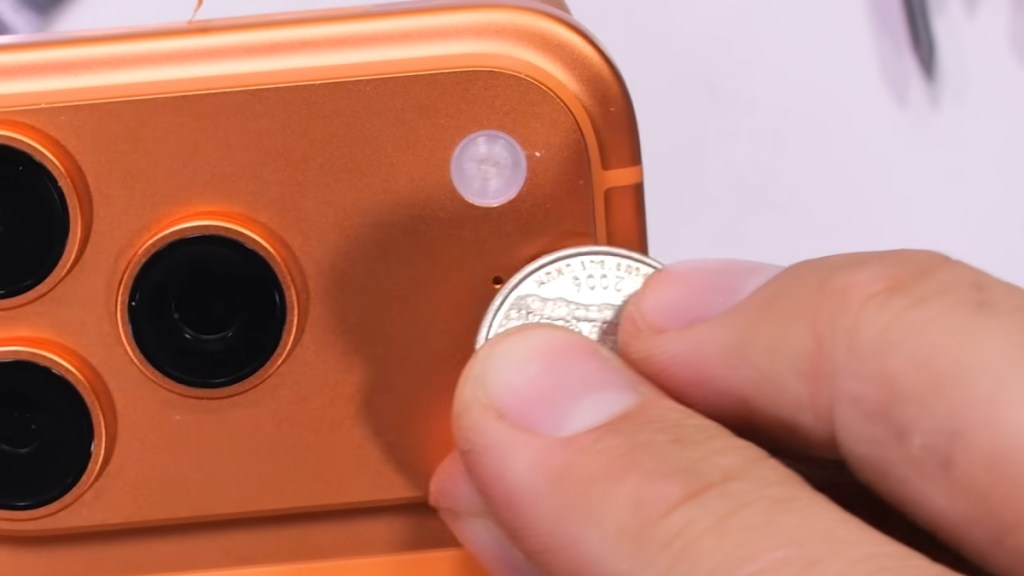 JerryrigEverything iPhone 17 Pro scratch test with a coin snippet
