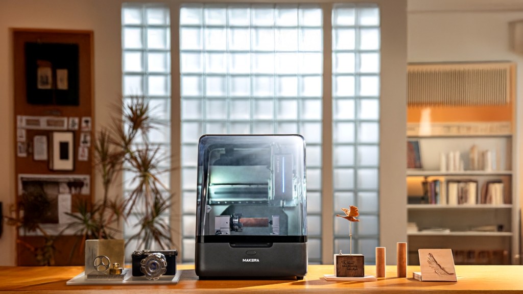 Makera Z1 on a wooden desk with all its accessories