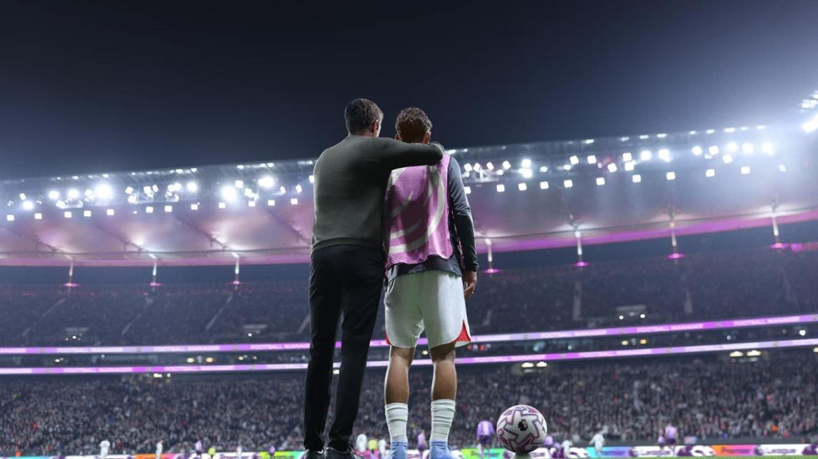 Manager giving touchline instructions to a player in FM26