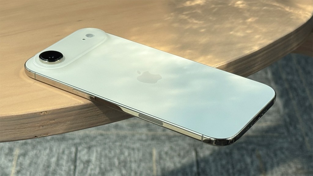 iPhone AIr laying on a wooden desk 