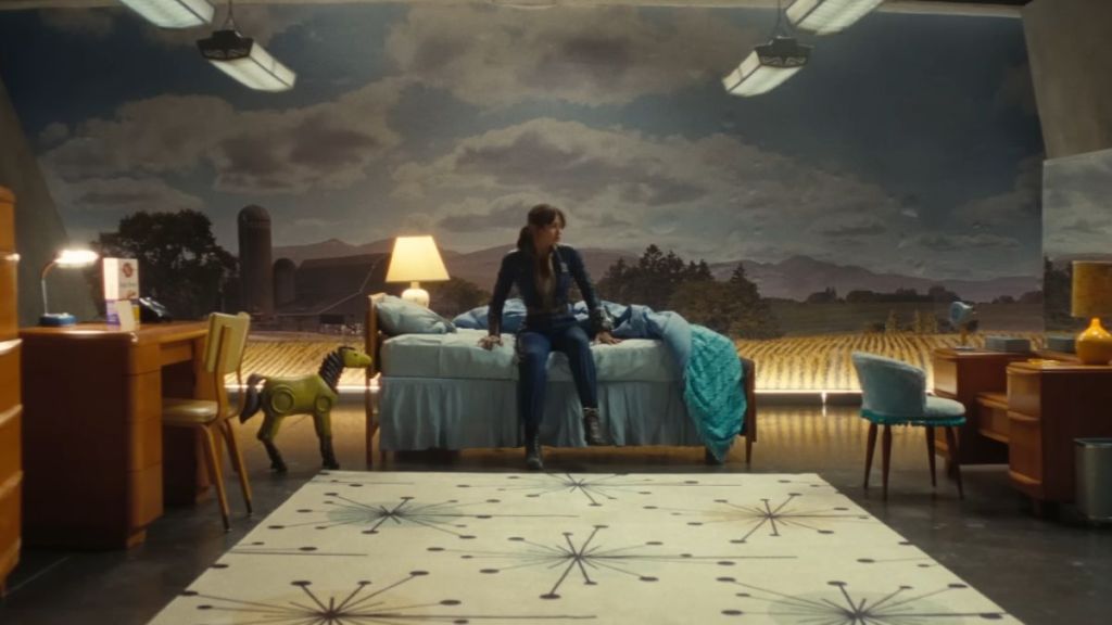 Lucy sitting on a bed in Fallout Season 2