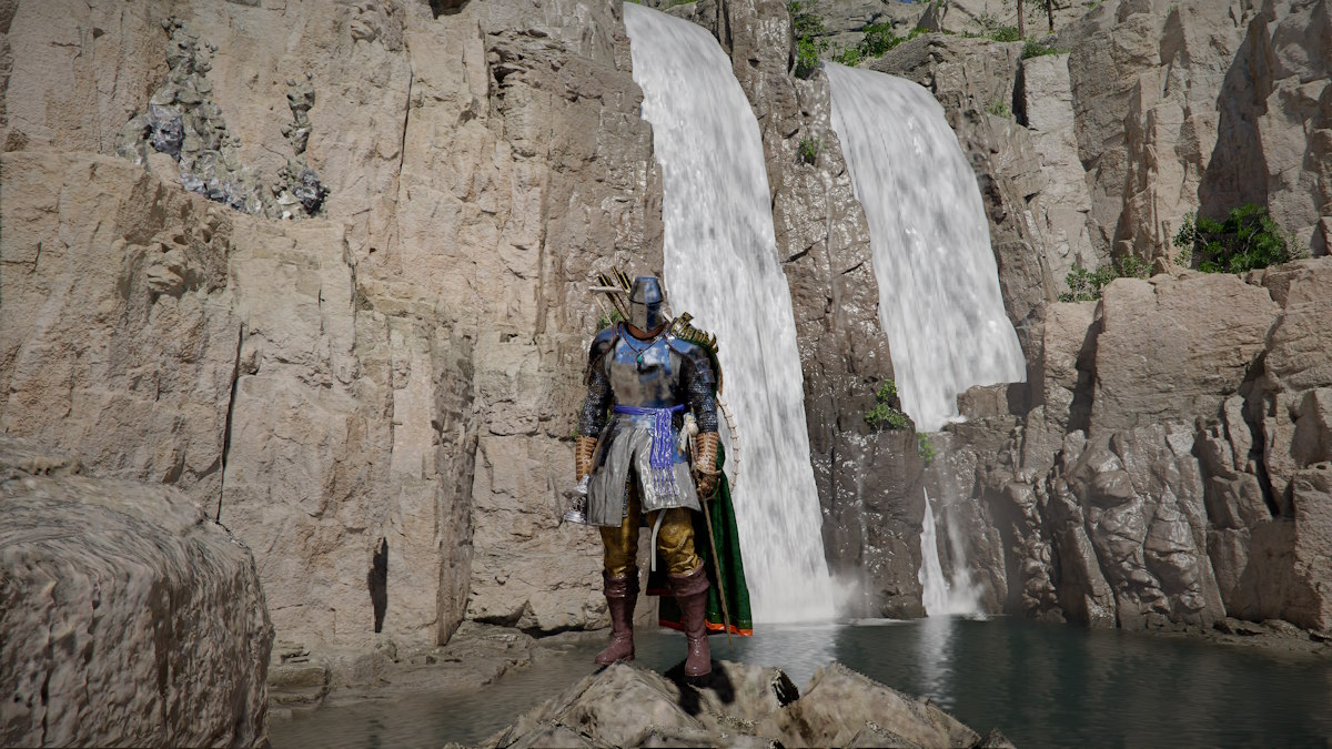 Kliff standing in front of a waterfall