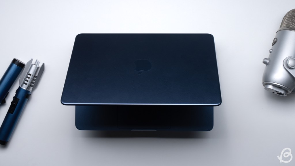 top down shot of the MacBook Neo with semi open lid