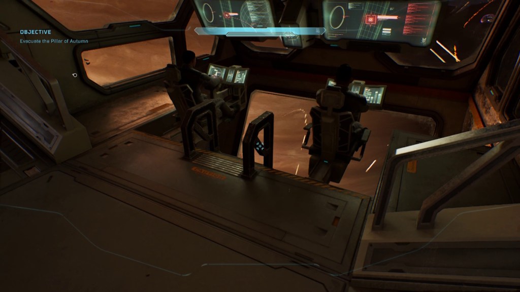 Use the ladder in between the two pilots andclimb down to the pit area in Halo Campaign Evolved