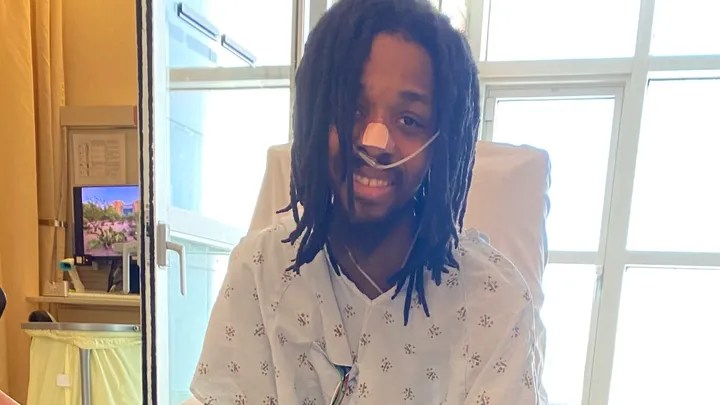 Jerry Fort wearing a hospital gown in a hospital.